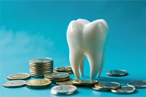 A single tooth surrounded by coins